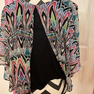 Can be worn with opening in front or in back